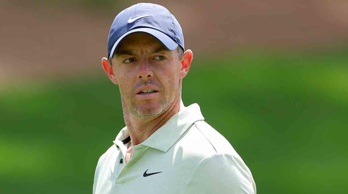 Rory McIlroy walks the first fairway during the final round of the 2024 Players Championship at TPC Sawgrass in Ponte Vedra Beach, Fla.